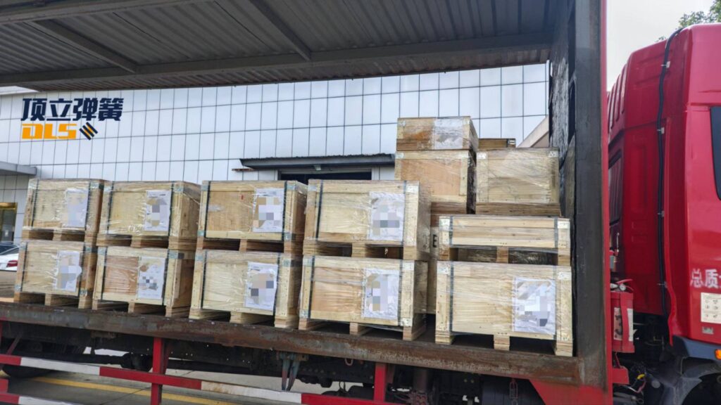 Truck loaded with wooden crates for US export of mold springs (die springs) and compression springs