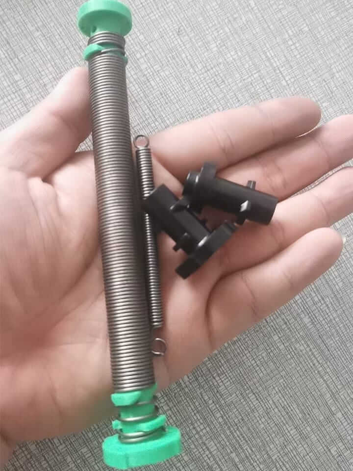Client’s handmade extension spring and customized injection-molded end fittings before mass production