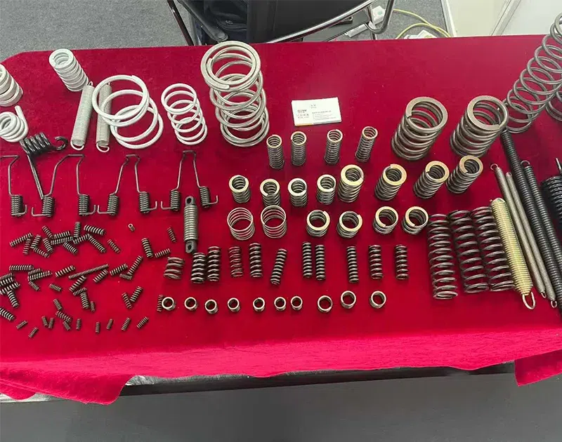 Variety of industrial springs including compression springs, extension springs, and torsion springs manufactured by Dili Spring